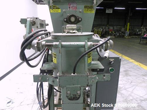 Used Chantland Model 4198-1C Weighmaster II Open Mouth Auger Bag Filler. Machine is rated at up to (5) 50 lb bags per minute. Has Flex-Weigh model HSF load cell for a weight range:  20 lbs to 110 lbs...