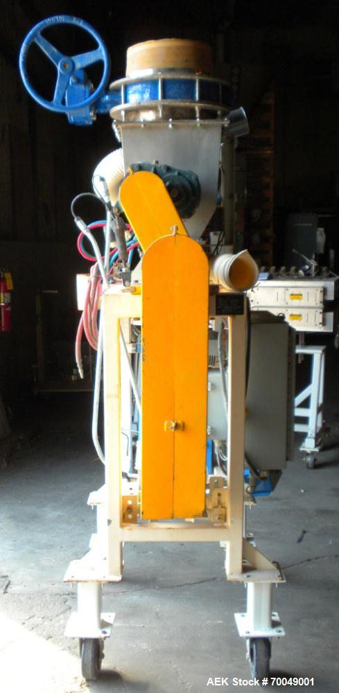 Used Robey Packaging Equipment Auger Bag Filler, Model SA 25.Designed as an auger valve bag packerwith a right angle discharge down spoutand bag clamps for open mouth bag filling.Foot pedal swithced ...
