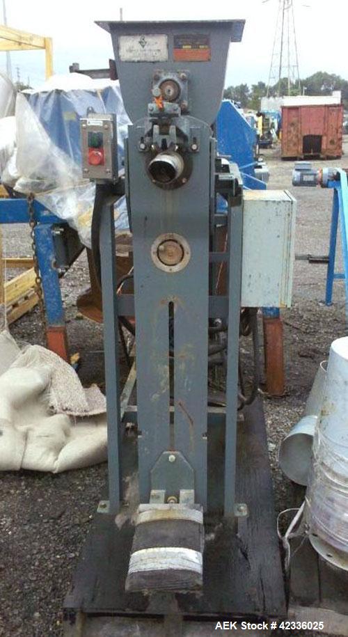 Used Stoker Auger Bag Packer, Model CR. Stainless steel spout, carbon steel auger, agitated feed hopper, 3 hp, 575 volt motor.