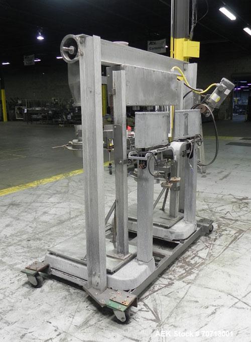 Used Fairbanks Model 41-3132 Double Head Bag Filling and Weighing Machine. Has (2) Fairbanks model 41-3132 scales with capacities of up to 1,000lbs. Filler powered by (1) Baldor 3/4 hp 1140 rpm motor...