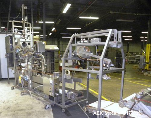 Used Taylor Products TOMP Open Mouth Bag Hanger with APO Bulk Bag Filling Line. Machine is capable of speeds up to 15 bags per minute. Can run paper or poly bags with 300 count magazine. Has a model ...