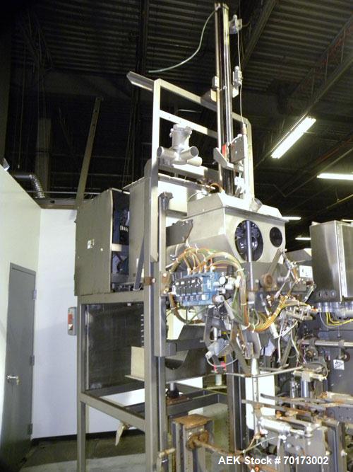 Used Taylor Products TOMP Open Mouth Bag Hanger with APO Bulk Bag Filling Line. Machine is capable of speeds up to 15 bags per minute. Can run paper or poly bags with 300 count magazine. Has a model ...