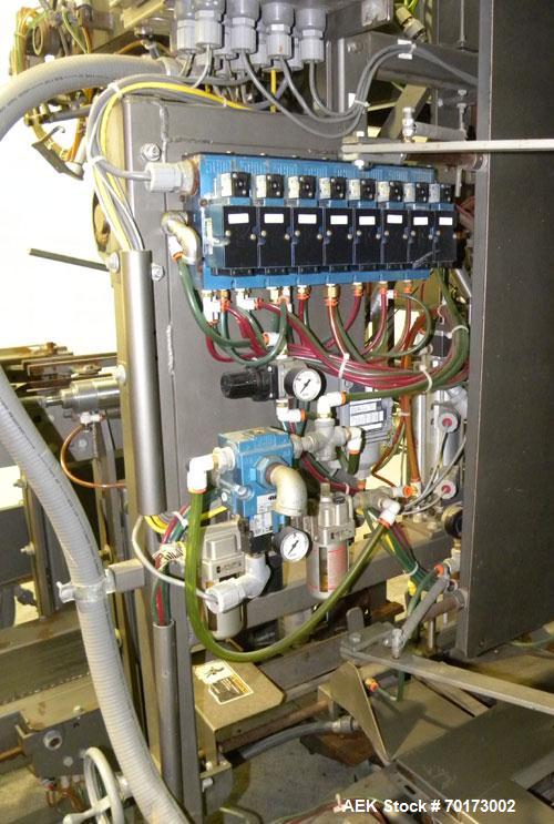 Used Taylor Products TOMP Open Mouth Bag Hanger with APO Bulk Bag Filling Line. Machine is capable of speeds up to 15 bags per minute. Can run paper or poly bags with 300 count magazine. Has a model ...