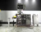 Used- Bemis Model 7115E168 Bag Filler with Model 6162A2 Duplex Net Weigh Scale & automated Bemis bag placer with blank bag m...