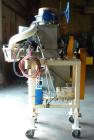 Used Robey Packaging Equipment Auger Bag Filler, Model SA 25.Designed as an auger valve bag packerwith a right angle discharge down spoutand bag clamps for open mouth bag filling.Foot pedal swithced ...