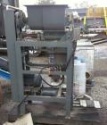 Used Stoker Auger Bag Packer, Model CR. Stainless steel spout, carbon steel auger, agitated feed hopper, 3 hp, 575 volt motor.