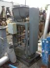 Used Stoker Auger Bag Packer, Model CR. Stainless steel spout, carbon steel auger, agitated feed hopper, 3 hp, 575 volt motor.