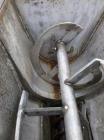 Used Stoker Auger Bag Packer, Model CR. Stainless steel spout, carbon steel auger, agitated feed hopper, 3 hp, 575 volt motor.