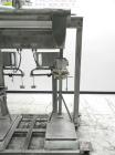 Used Fairbanks Model 41-3132 Double Head Bag Filling and Weighing Machine. Has (2) Fairbanks model 41-3132 scales with capacities of up to 1,000lbs. Filler powered by (1) Baldor 3/4 hp 1140 rpm motor...