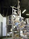 Used Taylor Products TOMP Open Mouth Bag Hanger with APO Bulk Bag Filling Line. Machine is capable of speeds up to 15 bags per minute. Can run paper or poly bags with 300 count magazine. Has a model ...