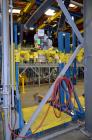Used Flexicon Bulk Bag Filling System Consisting Of: (2) Twin-Centerpost Bulk Bag Fillers, carbon steel. Manual fill head height adjustment, pneumatically retractable bag hooks, inflatable connector ...
