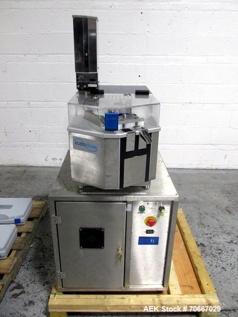 Used Capsugel Xcelodose Capsule Filler, Model XD600. With cabinet and 00, 0, 1, 2, 3, 4 change parts, serial# 600-1-040.