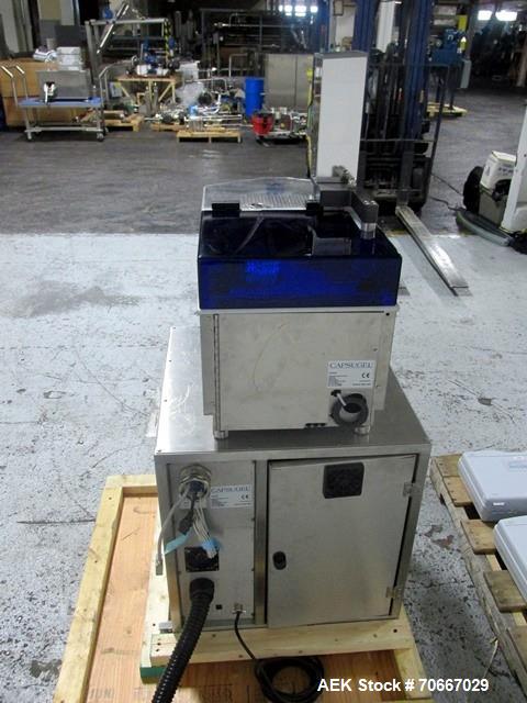 Used Capsugel Xcelodose Capsule Filler, Model XD600. With cabinet and 00, 0, 1, 2, 3, 4 change parts, serial# 600-1-040.