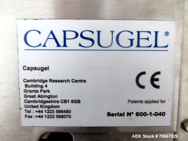 Used Capsugel Xcelodose Capsule Filler, Model XD600. With cabinet and 00, 0, 1, 2, 3, 4 change parts, serial# 600-1-040.