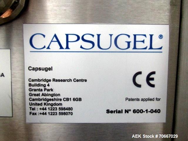 Used Capsugel Xcelodose Capsule Filler, Model XD600. With cabinet and 00, 0, 1, 2, 3, 4 change parts, serial# 600-1-040.