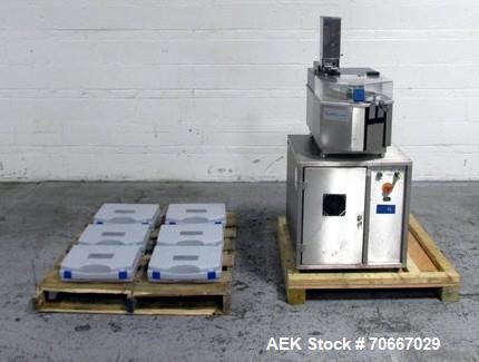 Used Capsugel Xcelodose Capsule Filler, Model XD600. With cabinet and 00, 0, 1, 2, 3, 4 change parts, serial# 600-1-040.