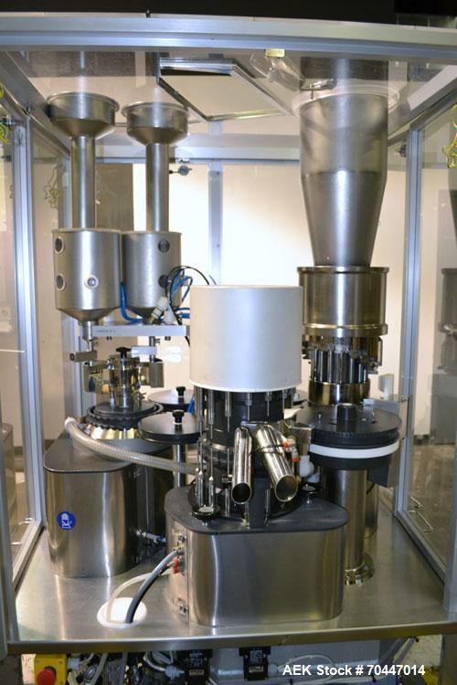 Used MG2 Futura automatic capsule filler capable of speeds up to 48,000 capsules per hour. Can run capsule sizes from 000 to 5, including tamper evident with proper changeparts. Currently haas change...
