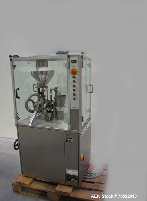 Used Zanasi AZ5 Capsule Filling/Closing Machine.  Maximum output 4,200 capsules/hour, 3/380V/60 hz, for capsule sizes 000 - 5, integrated vacuum pump and vacuum cleaner, format sets for sizes 0 / 2.