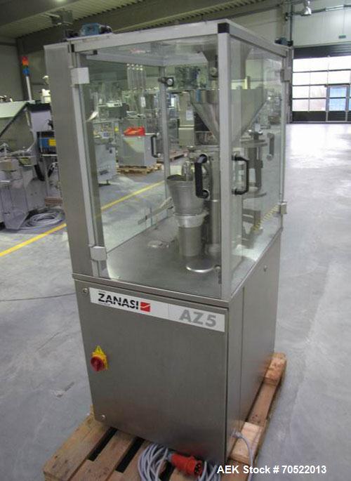 Used Zanasi AZ5 Capsule Filling/Closing Machine.  Maximum output 4,200 capsules/hour, 3/380V/60 hz, for capsule sizes 000 - 5, integrated vacuum pump and vacuum cleaner, format sets for sizes 0 / 2.