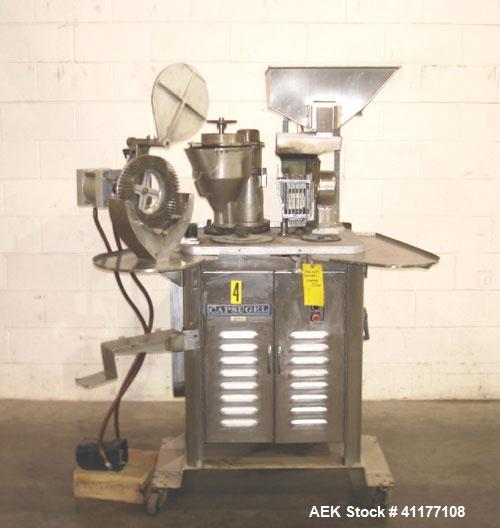 Used Capsugel Semi Automatic Capsule Filler, Model 8S. 12,000 to 15,000 capsules per hour for sizes 00 through 4 dependent upon volume per ring, operator experience and filling conditions (see Room C...