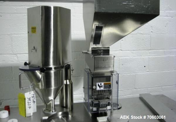 Used Capsugel Ultra 8 II Capsule Filler. Stainless steel construction, feed hopper with chute, powder fill station with agitated hopper, on stand, change parts for 00-4 capsule sizes (unit to be supp...