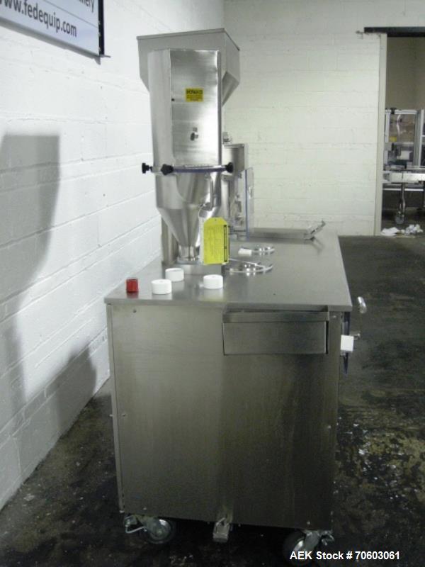 Used Capsugel Ultra 8 II Capsule Filler. Stainless steel construction, feed hopper with chute, powder fill station with agitated hopper, on stand, change parts for 00-4 capsule sizes (unit to be supp...
