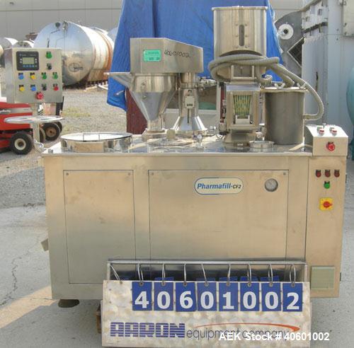 Used Anchor Mark Pharmafill High Speed Capsule Filling Machine, Model CF2. Designed to fill hard gelatin capsules with powder, granules or pellets from capsule sizes 00 to 5, currently set-up on size...