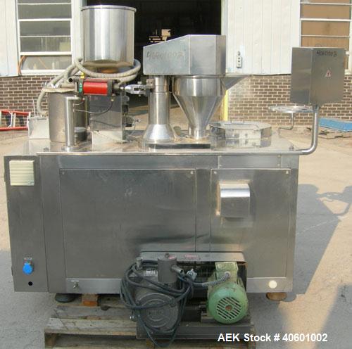 Used Anchor Mark Pharmafill High Speed Capsule Filling Machine, Model CF2. Designed to fill hard gelatin capsules with powder, granules or pellets from capsule sizes 00 to 5, currently set-up on size...