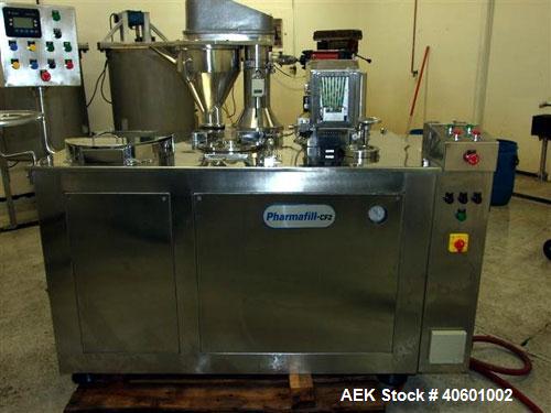 Used Anchor Mark Pharmafill High Speed Capsule Filling Machine, Model CF2. Designed to fill hard gelatin capsules with powder, granules or pellets from capsule sizes 00 to 5, currently set-up on size...