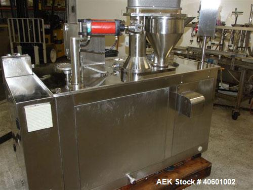 Used Anchor Mark Pharmafill High Speed Capsule Filling Machine, Model CF2. Designed to fill hard gelatin capsules with powder, granules or pellets from capsule sizes 00 to 5, currently set-up on size...