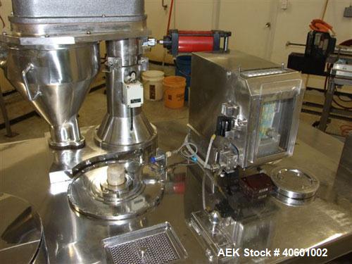Used Anchor Mark Pharmafill High Speed Capsule Filling Machine, Model CF2. Designed to fill hard gelatin capsules with powder, granules or pellets from capsule sizes 00 to 5, currently set-up on size...