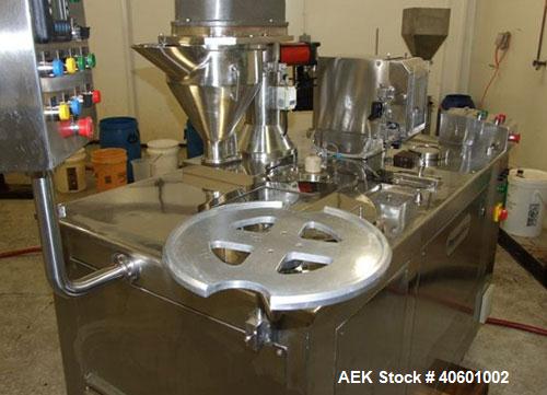 Used Anchor Mark Pharmafill High Speed Capsule Filling Machine, Model CF2. Designed to fill hard gelatin capsules with powder, granules or pellets from capsule sizes 00 to 5, currently set-up on size...