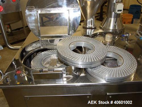 Used Anchor Mark Pharmafill High Speed Capsule Filling Machine, Model CF2. Designed to fill hard gelatin capsules with powder, granules or pellets from capsule sizes 00 to 5, currently set-up on size...