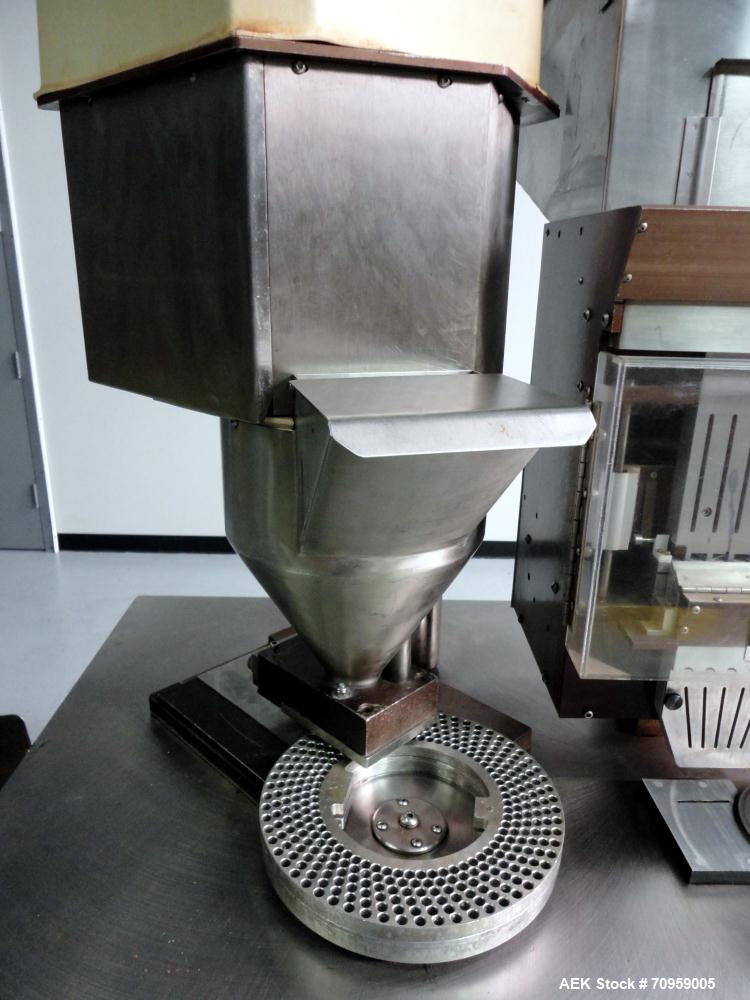 Used Shionogi Qualicaps STI Type 10 Semi-Automatic Capsule Filler. Capable of speeds up to 25,000 capsules per hour. Machine is setup with size 0 Change parts, includes a set of 00 change parts. Has ...