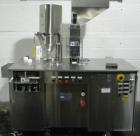 Used Capsugel Ultra 8 II Capsule Filler. Stainless steel construction, feed hopper with chute, powder fill station with agitated hopper, on stand, change parts for 00-4 capsule sizes (unit to be supp...