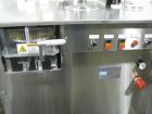 Used Capsugel Ultra 8 II Capsule Filler. Stainless steel construction, feed hopper with chute, powder fill station with agitated hopper, on stand, change parts for 00-4 capsule sizes (unit to be supp...