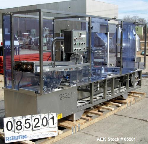 Used Holmatic Inline Single Lane Cup Filler/Lidder/Sealer, Model PR1S. Set up for 5-1/2" diameter cups. Includes cup dropper, filler,film seal (incomplete), and lid placer.Last used in food salads.1/...