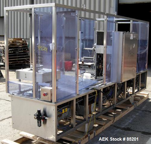 Used Holmatic Inline Single Lane Cup Filler/Lidder/Sealer, Model PR1S. Set up for 5-1/2" diameter cups. Includes cup dropper, filler,film seal (incomplete), and lid placer.Last used in food salads.1/...