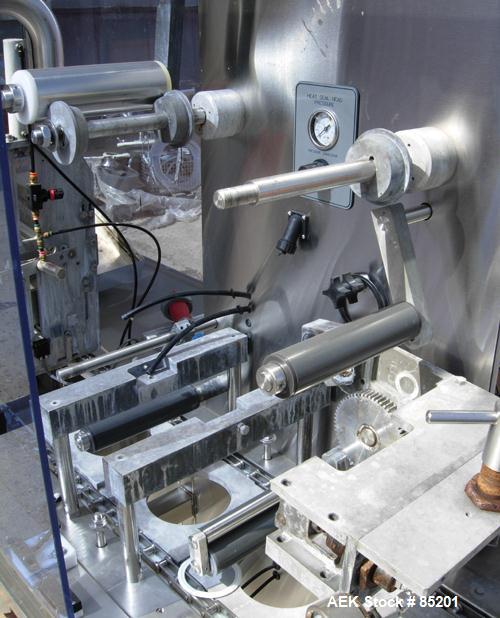 Used Holmatic Inline Single Lane Cup Filler/Lidder/Sealer, Model PR1S. Set up for 5-1/2" diameter cups. Includes cup dropper, filler,film seal (incomplete), and lid placer.Last used in food salads.1/...