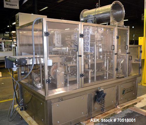 Used Pack Line PXM-5 Cup Filling and Sealing Machine. Unit is a five lane system with speeds rated from 30 to 50 cycles per minute (depending on product and cup size). Currently set up for 3" diamete...