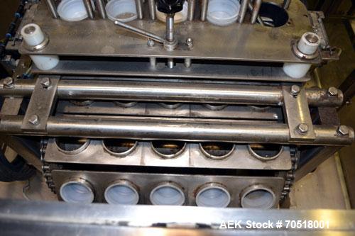 Used Pack Line PXM-5 Cup Filling and Sealing Machine. Unit is a five lane system with speeds rated from 30 to 50 cycles per minute (depending on product and cup size). Currently set up for 3" diamete...