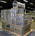 Used Pack Line PXM-5 Cup Filling and Sealing Machine. Unit is a five lane system with speeds rated from 30 to 50 cycles per minute (depending on product and cup size). Currently set up for 3