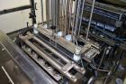 Used Pack Line PXM-5 Cup Filling and Sealing Machine. Unit is a five lane system with speeds rated from 30 to 50 cycles per minute (depending on product and cup size). Currently set up for 3