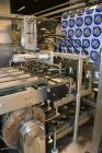 Used Pack Line PXM-5 Cup Filling and Sealing Machine. Unit is a five lane system with speeds rated from 30 to 50 cycles per minute (depending on product and cup size). Currently set up for 3