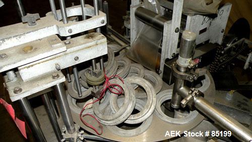 Used Autoprod Cup Filler, Model RO-A3, 8 station, stainless steel. Currently set up for 4-1/4" diameter cups. Jacketed stainless steel hopper. Includes change parts, film die cut station, cup feed st...