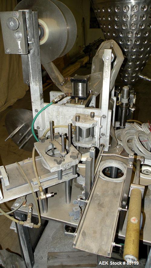 Used Autoprod Cup Filler, Model RO-A3, 8 station, stainless steel. Currently set up for 4-1/4" diameter cups. Jacketed stainless steel hopper. Includes change parts, film die cut station, cup feed st...