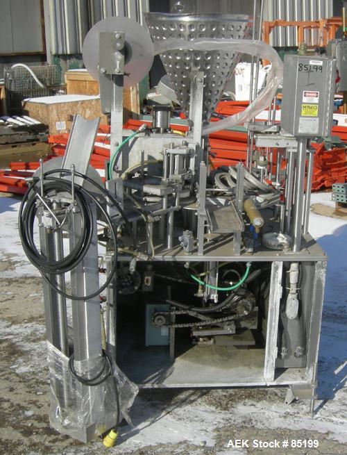 Used Autoprod Cup Filler, Model RO-A3, 8 station, stainless steel. Currently set up for 4-1/4" diameter cups. Jacketed stainless steel hopper. Includes change parts, film die cut station, cup feed st...