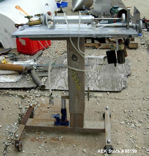 Used Autoprod Cup Filler, Model RO-A3, 8 station, stainless steel. Currently set up for 4-1/4" diameter cups. Jacketed stainless steel hopper. Includes change parts, film die cut station, cup feed st...