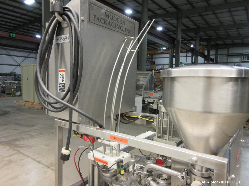 Used Modern Packaging Inc. Model SR-8DC Rotary Cup Filler/Sealer