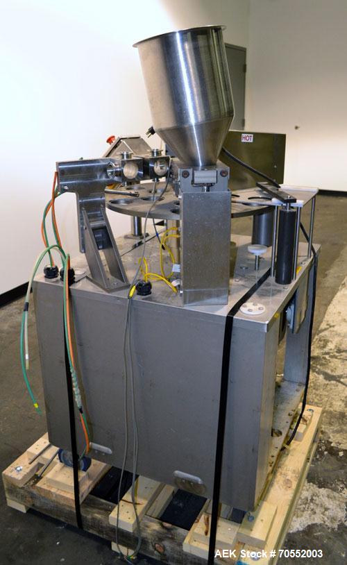 Used Wilpack Packaging 201 Seal N PeelRotary Cup Filler capable of speeds up to 80 cpm.Max cup diameter 3-1/2" (with changeparts).Dual lane six station unit with bottom up fill, dual positive displac...